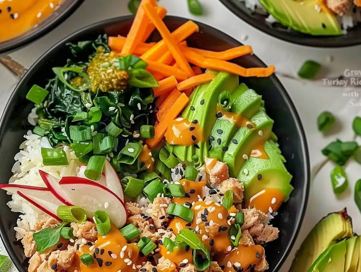 Ground turkey rice bowl with bang bang sauce and fresh vegetables.